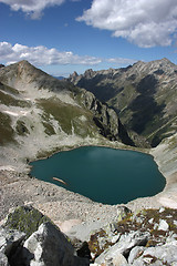 Image showing Lake in mountains. Alpine latitudes at different times of the ye