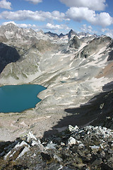 Image showing Lake in mountains. Alpine latitudes at different times of the ye