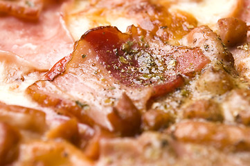 Image showing Italian pizza with bacon, salami and mozzarella cheese