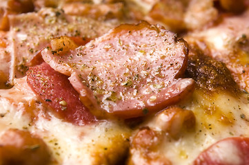 Image showing Italian pizza with bacon, salami and mozzarella cheese