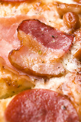 Image showing Italian pizza with bacon, salami and mozzarella cheese