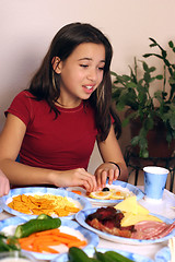 Image showing Girl having fun with her food