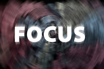 Image showing Focus word with motion rays on a chalkboard background 