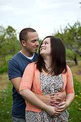 Image showing Couple Holding Hands Walking Outdoors