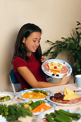 Image showing Girl having fun with her food