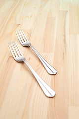 Image showing two fork on a pinewood table