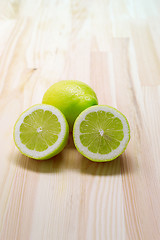 Image showing fresh lemon  over pinewood table