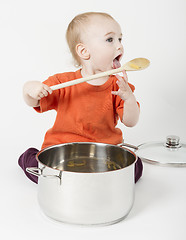 Image showing baby with big cooking pot