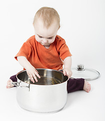 Image showing baby with big cooking pot