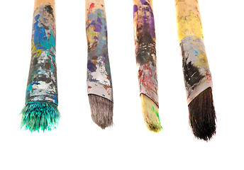 Image showing Dirty wooden paint brushes isolated on white 
