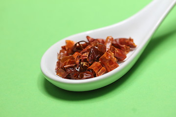 Image showing hot chili plant pieces on a spoon