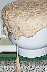 Image showing yeast dough running over