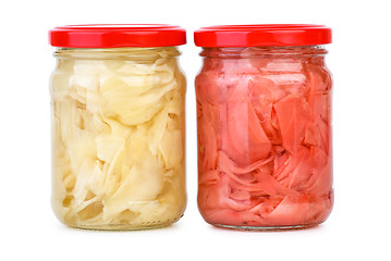 Image showing Glass jars with white and pink marinated sliced ginger roots