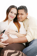 Image showing Happy pregnant couple expecting their baby over white