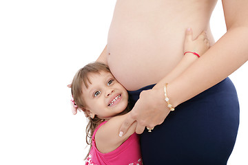 Image showing Pregnant mother with her small daughter studio shot 