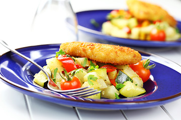 Image showing Fried fish on vegetables