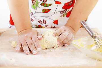 Image showing Woman kneading dough