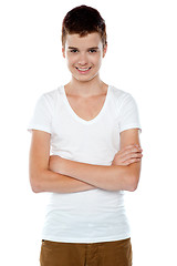 Image showing Smiling boy posing with crossed arms