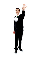 Image showing Cheerful young boy throwing paper