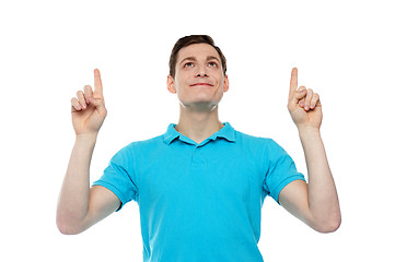Image showing Caucasian man point fingers up