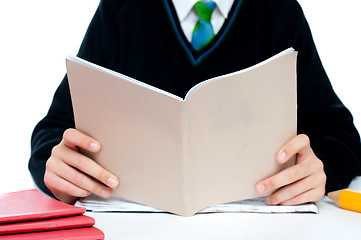 Image showing Cropped image of a school boy holding books