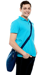 Image showing Teenage guy carrying laptop bag