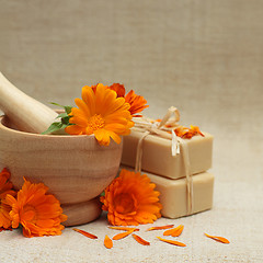 Image showing Alternative medicine background with calendula flowers and bath 