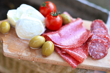 Image showing Italian cuisine. Gourmet food - salami, olives, mozzarella