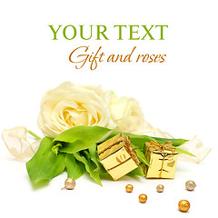 Image showing Gift, rose flowers and gold ribbon on white - luxury background