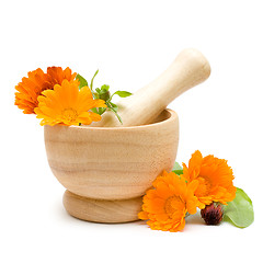 Image showing Calendula flowers, mortar and pestle isolated