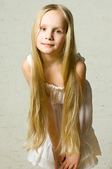 Image showing Smiling child girl with long blond hair - portrait