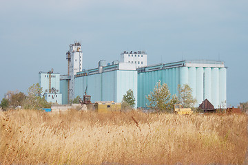 Image showing Grain elevator rises among the steppe
