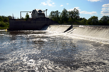 Image showing Dirty barmy river water flow weir dam barrage 