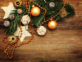 Image showing Christmas background with golden decoration, star and xmas tree