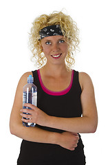 Image showing Beautiful blond woman holding bottle of water 