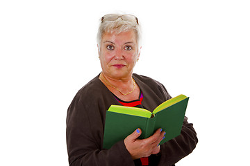 Image showing Female senior reading a book