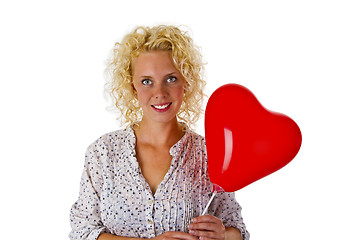 Image showing Young woman with red heart ballon
