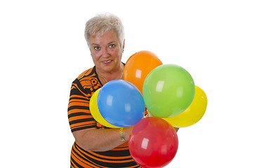 Image showing Female senior with colorful ballons 