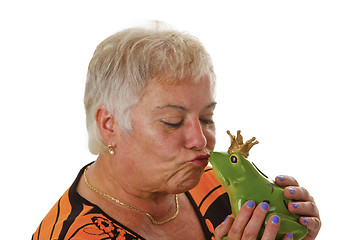 Image showing Senior female with a toy frog prince