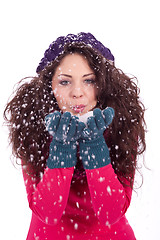 Image showing beautiful smiling brunette woman in snow in winter 