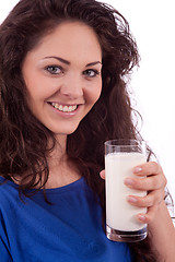 Image showing beautiful smiling woman is drinking milk