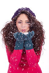 Image showing beautiful smiling brunette woman in snow in winter 