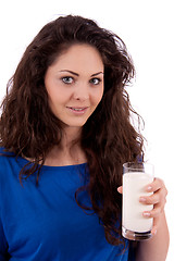 Image showing beautiful smiling woman is drinking milk