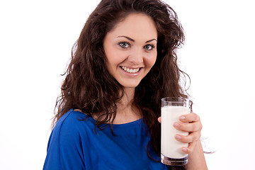 Image showing beautiful smiling woman is drinking milk