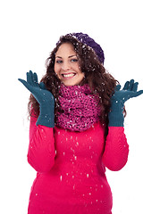 Image showing beautiful smiling brunette woman in snow in winter 