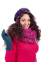 Image showing beautiful smiling brunette woman in snow in winter 