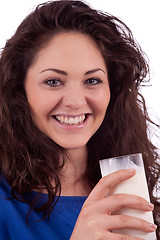 Image showing beautiful smiling woman is drinking milk