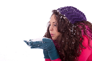 Image showing beautiful smiling brunette woman in snow in winter 