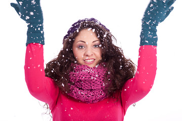 Image showing beautiful smiling brunette woman in snow in winter 