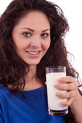 Image showing beautiful smiling woman is drinking milk